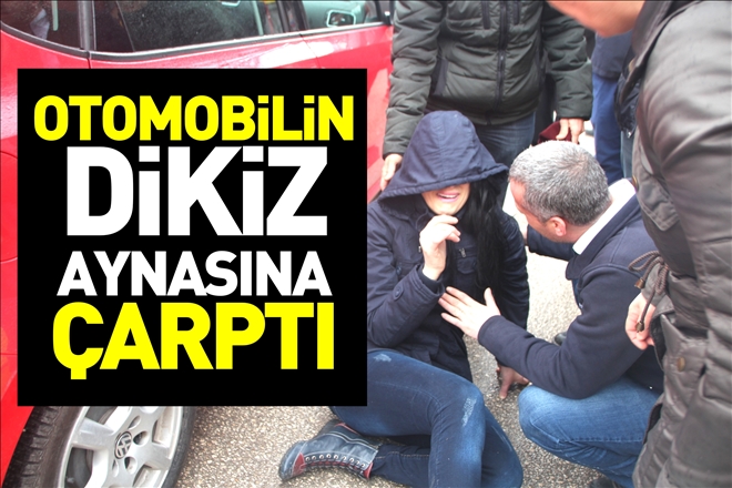 OTOMOBİLİN DİKİZ AYNASINA ÇARPTI