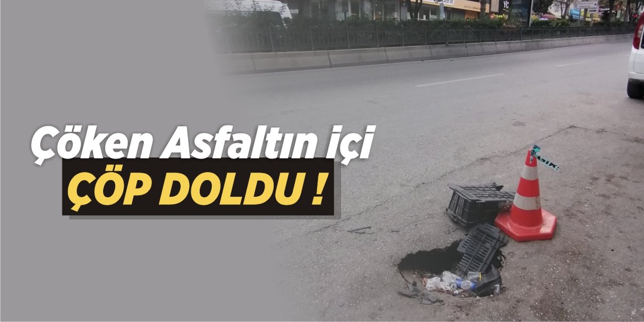 Çöken asfaltın içi çöp doldu